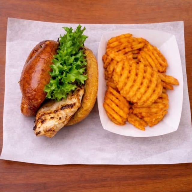 GRILLED CHICKEN SANDWICH WITH FRIES.