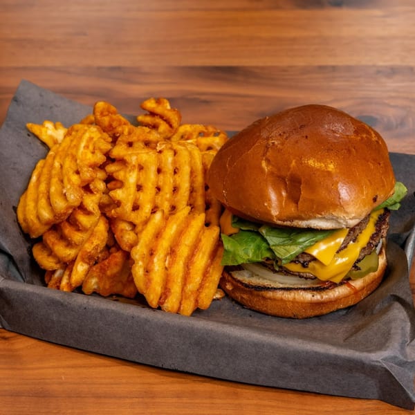 Stubbys double cheeseburger with lettuce, onion, and pickles, served with waffle fries.